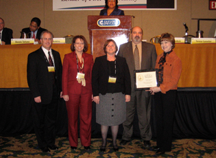 Ohio Farm Loan Program staff receives a certificate of appreciation for issuing the highest number of guaranteed loans nationally. (From left) Darren Metzger, Farm Loan Manager; Lisa Meadows, District Director; Jenny Breece, Farm Loan Specialist; David Drake, Farm Loan Chief; Teresa Lasseter, Administrator. 